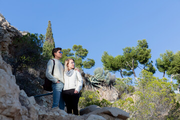 Two young people embraced looking at the horizon