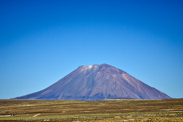 Volcano seen from the front with blue sky