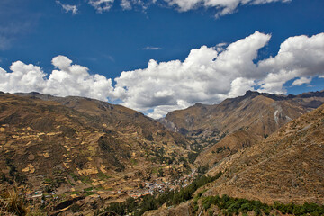 Big mountain landscape in Peru with a village and trees