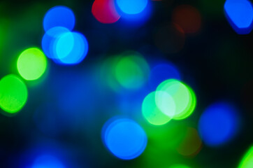 Abstract pattern of colorful bokeh lights on dark background