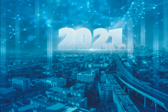 Happy new year 2021 and celebrate,smart city at night countdown to futuristic of modern,concept  smart network and connection technology and communication,with internet of thing,cityscape background - Powered by Adobe