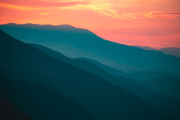 Sun setts over  Caucasus Mountains. Joyful motivational bright colorful image. Georgia 