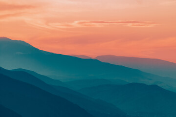 Fototapeta na wymiar Sun setts over Caucasus Mountains. Joyful motivational bright colorful image. Georgia 