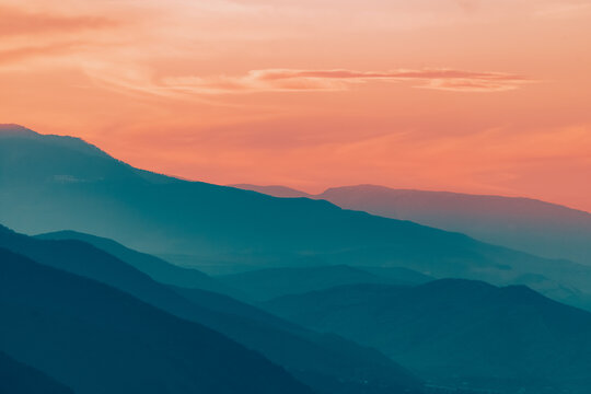 Sun setts over  Caucasus Mountains. Joyful motivational bright colorful image. Georgia 