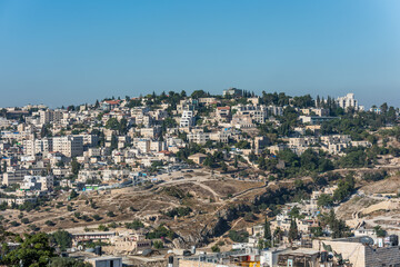 Fototapeta na wymiar Residential houses at the Mount Zion and Kidron Valley under the sunlight in the morning in Jerusalem, Israel