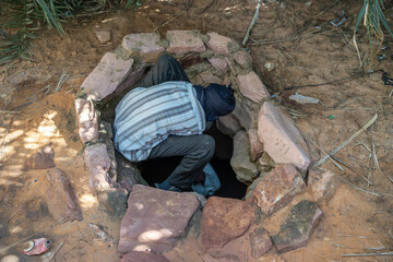Nomads collect water from water well, Chad, Africa