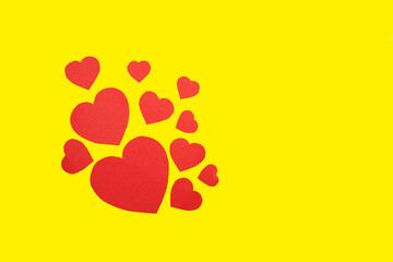 Paper hearts on a yellow background.Valentine's day greeting card.
