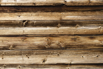 Warm color wood. Raw brown wooden wall background. Rustic tree desk with knots pattern. Countryside architecture wall. Village building construction. Wood industry texture.