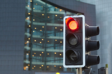 Traffic light with red light on. Sparkly Traffic light over urban intersection. Red light in the...