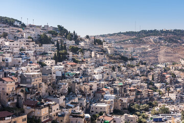 Fototapeta premium Residential houses at the Mount of Olive and Kidron Valley under the sunlight in the morning in Jerusalem, Israel