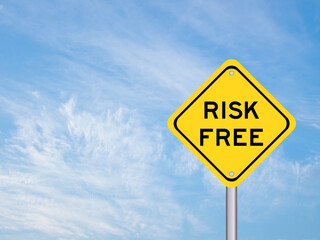 Yellow transportation sign with word risk free on blue sky background