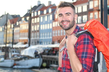 Young backpacker walking around Denmark