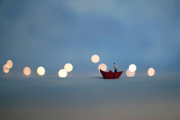 boatman and red paper boat on blue background