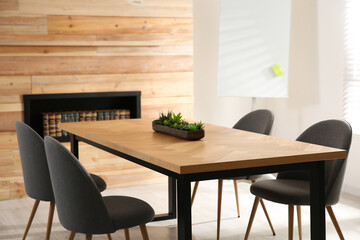 Modern meeting room interior with large table and chairs