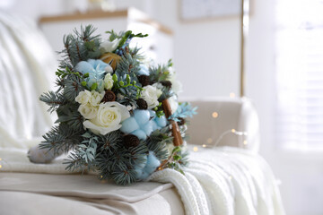 Beautiful wedding winter bouquet on sofa indoors. Space for text