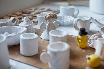 Fototapeta na wymiar Creative workshop studio - clay pottery glazing for kids.
