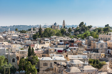 Obraz premium Aerial view of rooftops of buildings in the old city with Abbey of the Dormition of Jerusalem. View from the Lutheran Church of the Redeemer.
