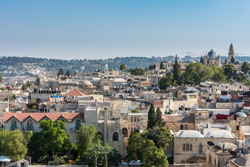 Fototapeta premium Aerial view of rooftops of buildings in the old city with Abbey of the Dormition of Jerusalem. View from the Lutheran Church of the Redeemer.