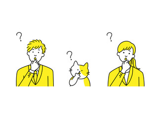 首をかしげるスーツ男女と猫