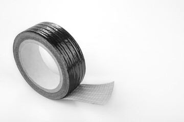 Roll of the Black duct tape for repair on a white