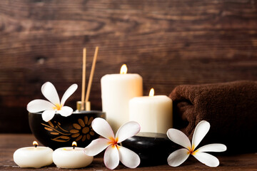 Obraz na płótnie Canvas Thai spa massage. Spa treatment cosmetic beauty. Therapy aromatherapy for care body women with candles for relax wellness. Aroma and salt scrub setting ready