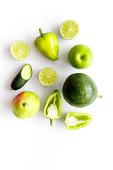 Background of raw green vegetables and herbs, top view
