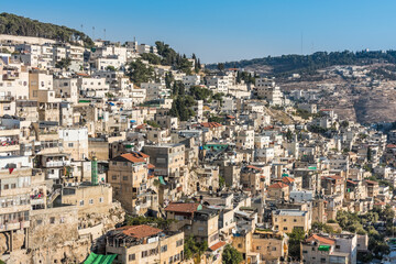 Fototapeta na wymiar Residential houses under the sunlight at the Mount of Olive and Kidron Valley in Jerusalem, Israel