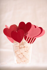 Red and pink hearts in marshmallow on white background
