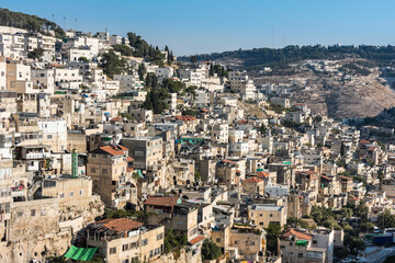Fototapeta na wymiar Residential houses under the sunlight at the Mount of Olive and Kidron Valley in Jerusalem, Israel