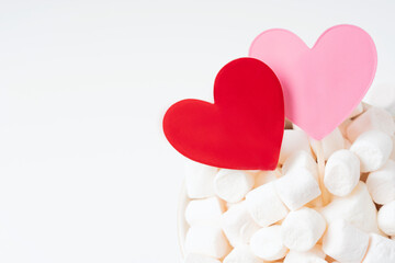 Red and pink hearts in marshmallow on white background