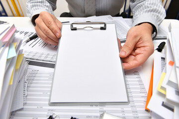 business concept, blank paper sheet with copy space for text - businessman working with reports in...
