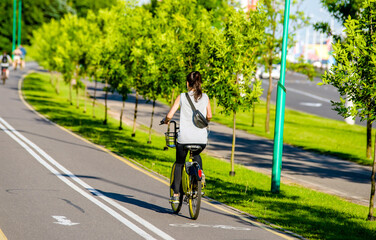 Fototapeta premium Cyclist ride on the bike path in the city Park 
