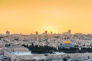 Fototapeta na wymiar Old city of Jerusalem on the temple mount under beautiful sunset in the evening with golden dome of the rock, sunset view from the Mount of Olives