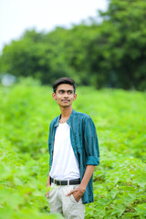 Young indian man showing expression over nature background