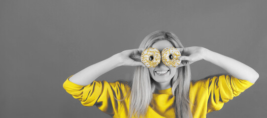 Portrait in duotone colors of woman with donuts