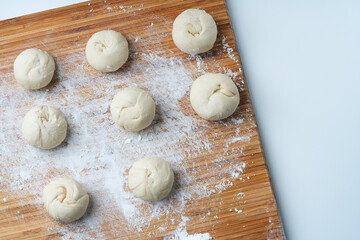 Fototapeta na wymiar Uncooked dough for buns