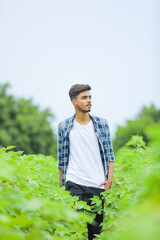 Young indian man showing expression over nature background