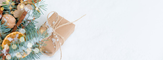 Christmas decorative banner fir branches and wooden eco-friendly toys, dry oranges, cinnamon...