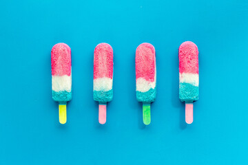 Pattern of ice cream on sticks. Colorful popsicle, top view