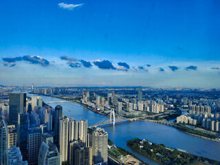 Liede Bridge, Pearl River and Guangzhou Skyline Skyscrapers. Green trees and sky. View from above. Guangdong. China. Asia	