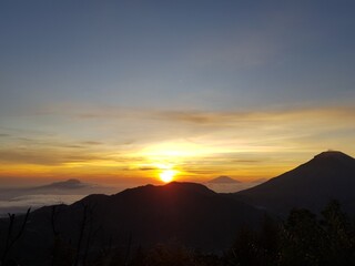 The sun rises on the top of Sikunir hill, Dieng, Java, Indonesia