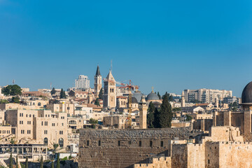 Obraz premium Historic buildings and skylines with Church of the holy sepulchre, Lutheran Church of the Redeemer, monastery of saint saviour, View from Mount of Olive, Jerusalem, Israel