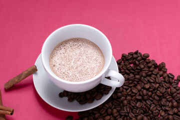 cup with espresso latte and isolated on pink background