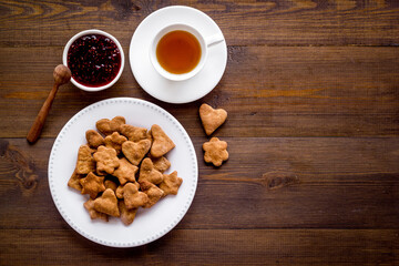 Freshly baked butter cookies with tea, top view