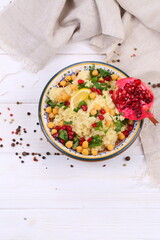 Eastern dish couscous with pomegranate and chickpeas