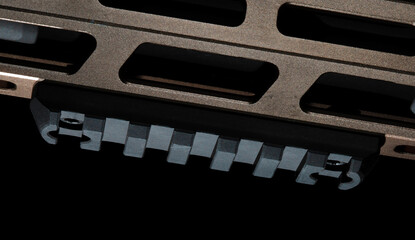 Accessory rail mounted on an assault rifle