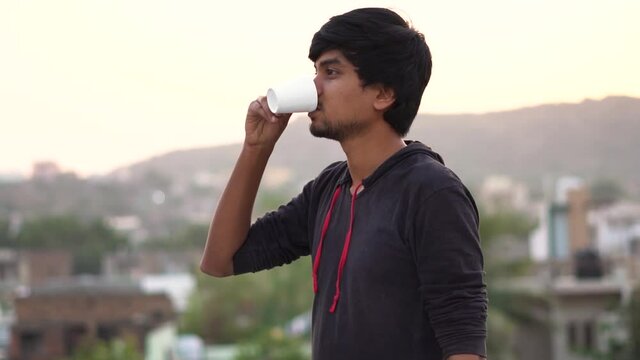 Portrait of an Indian man drinking coffee in the morning