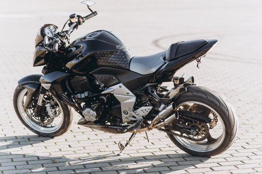 close up photo of a black sports motorcycle