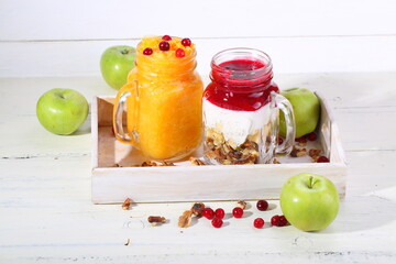 Fruit smoothies on white table