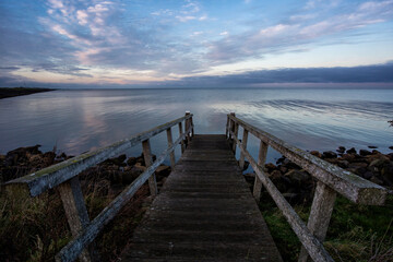 Fototapeta na wymiar landscape of the shores of the northwest side of the IJsselmeer at sunset in the Netherlands
